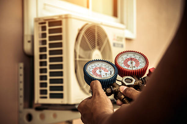 Professional Hvac technician working in Wellsville, PA